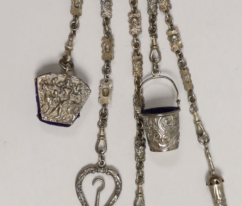 A Victorian white metal chatelaine with five accessories, import maker's mark for B.H. Joseph & Co, 32.7cm.